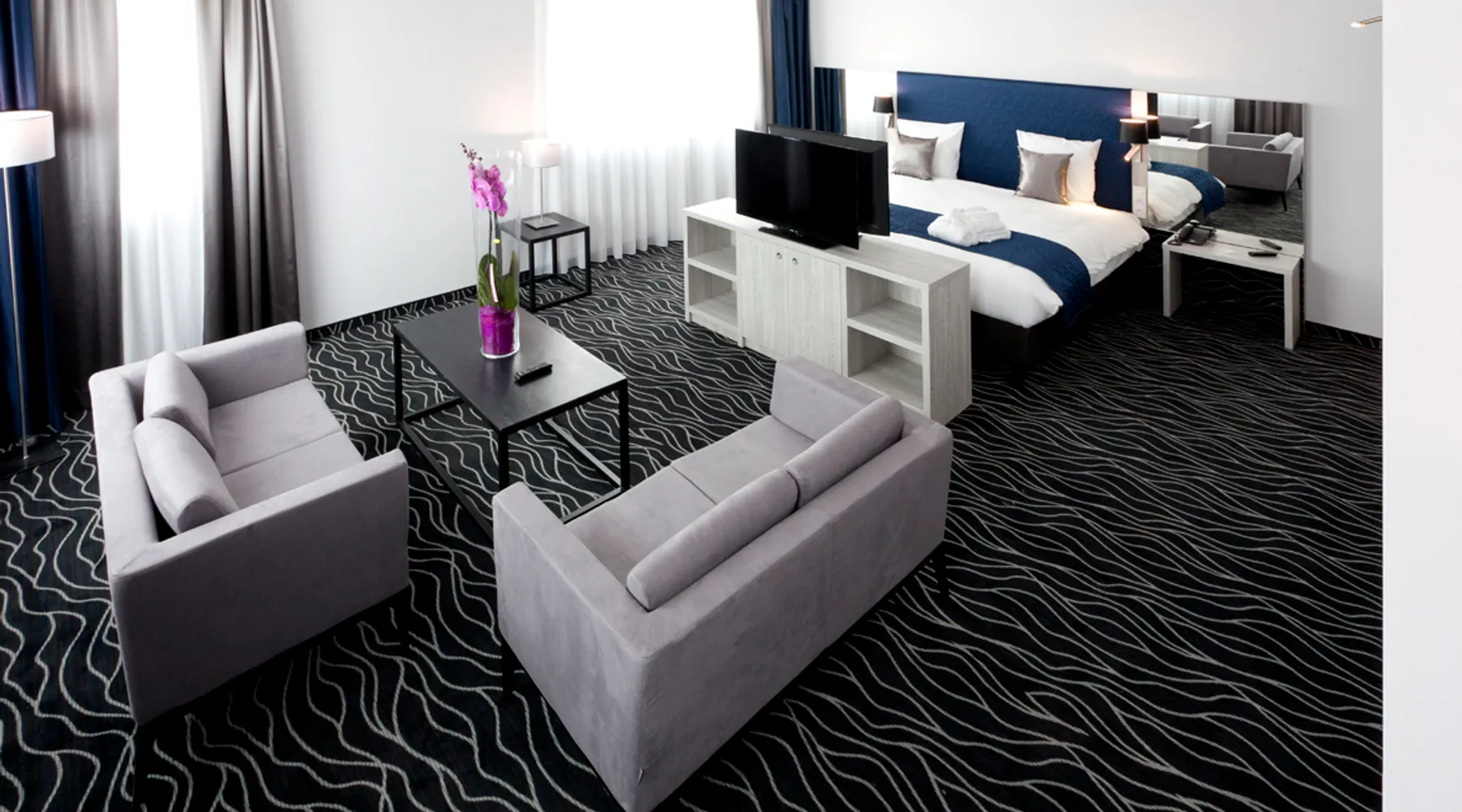 Coin salon moderne dans la Suite de l’hôtel Van der Valk Mons