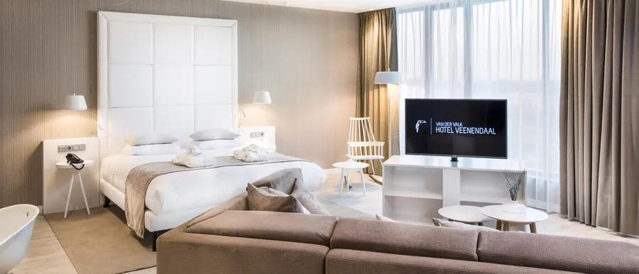 Wellness suite met sauna, stoomdouche, bad en kingsize bed