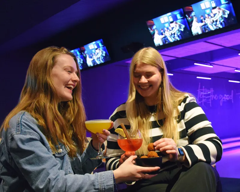 girls that are drinking in the bowling