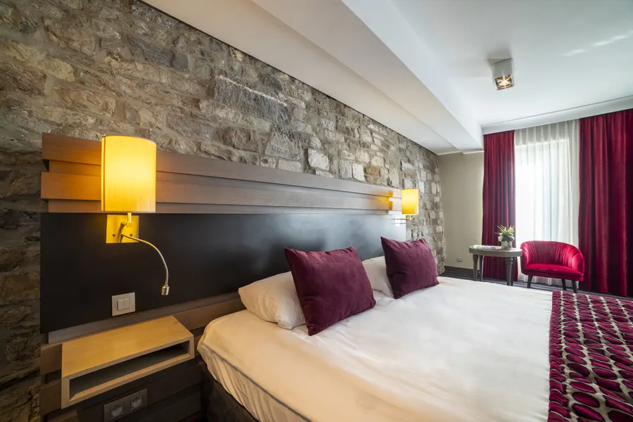 Chambre confortable de la Suite Deluxe à Liège