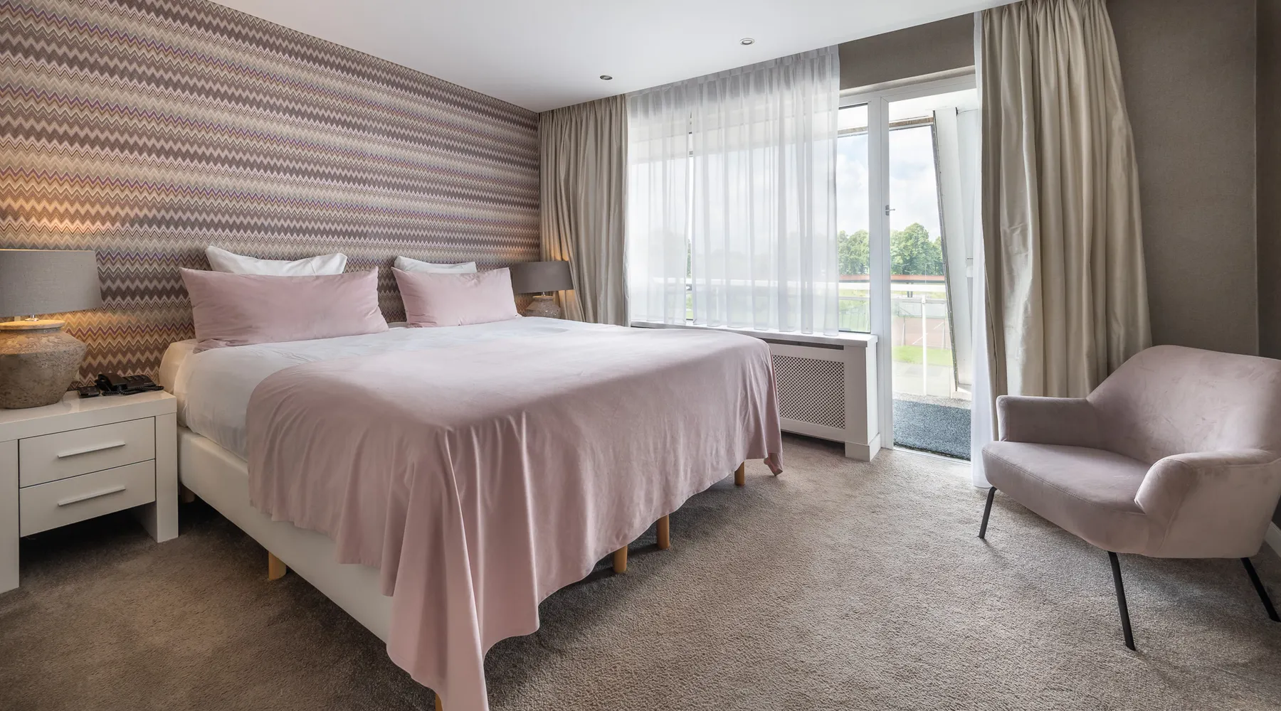 luxury hotel suite with large double bed