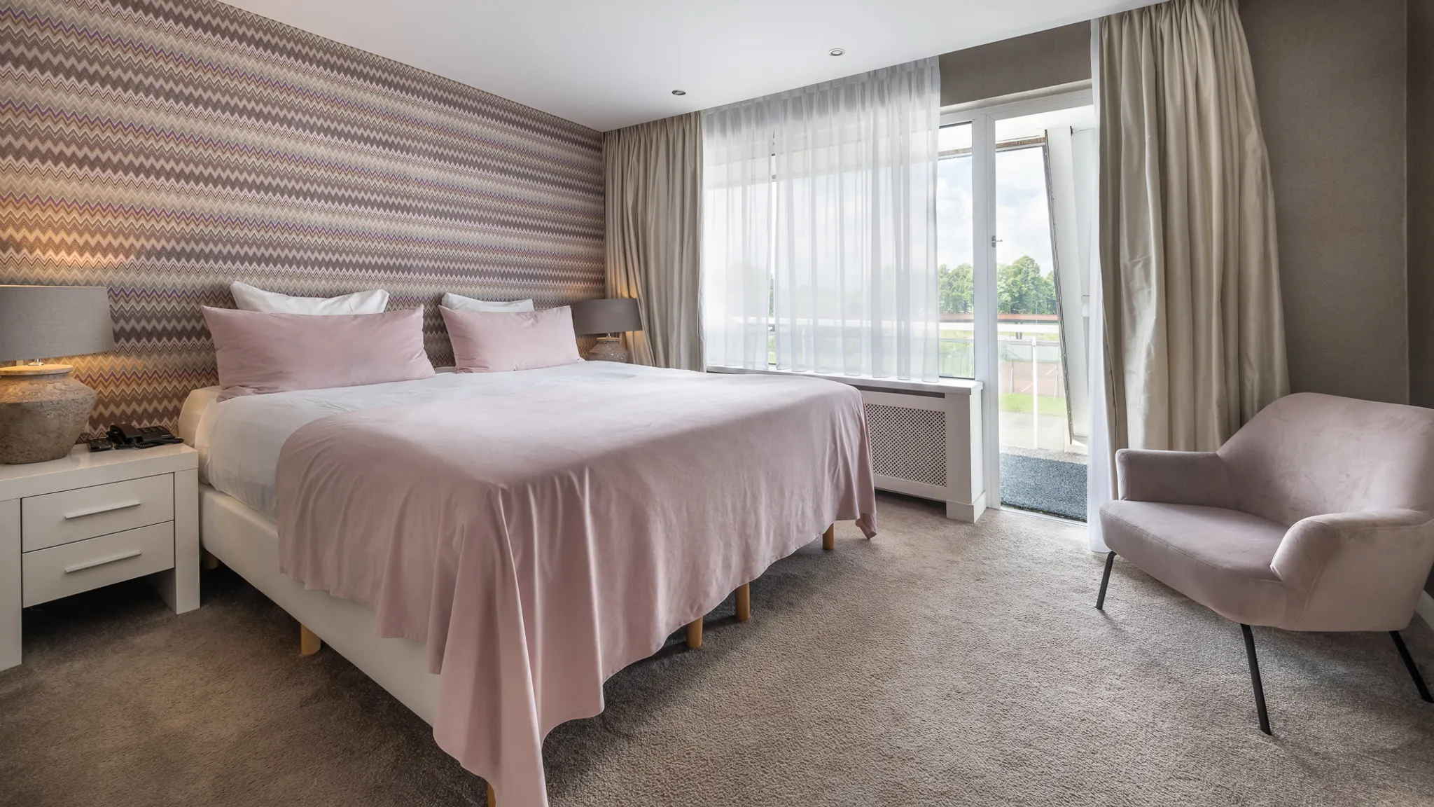 luxury hotel suite with large double bed