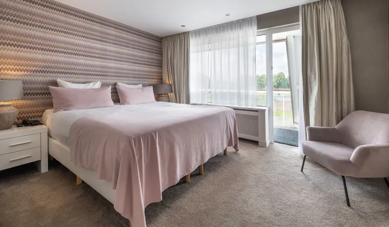 luxury hotel suite with large double bed